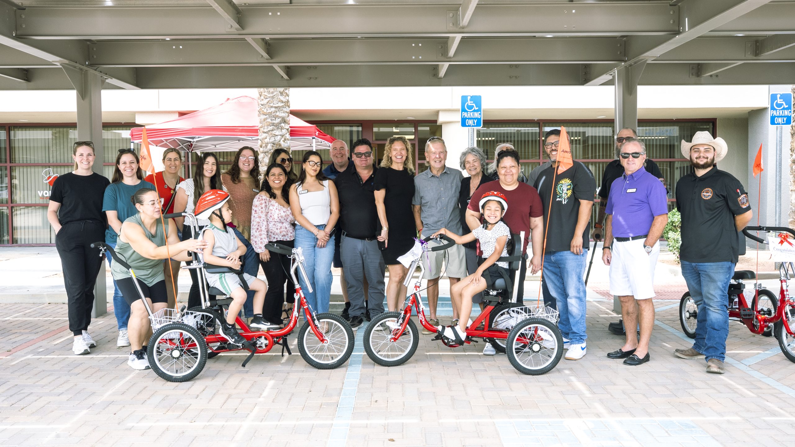 Children receiving adaptive bicycles through Variety of the Desert's Freedom Program.