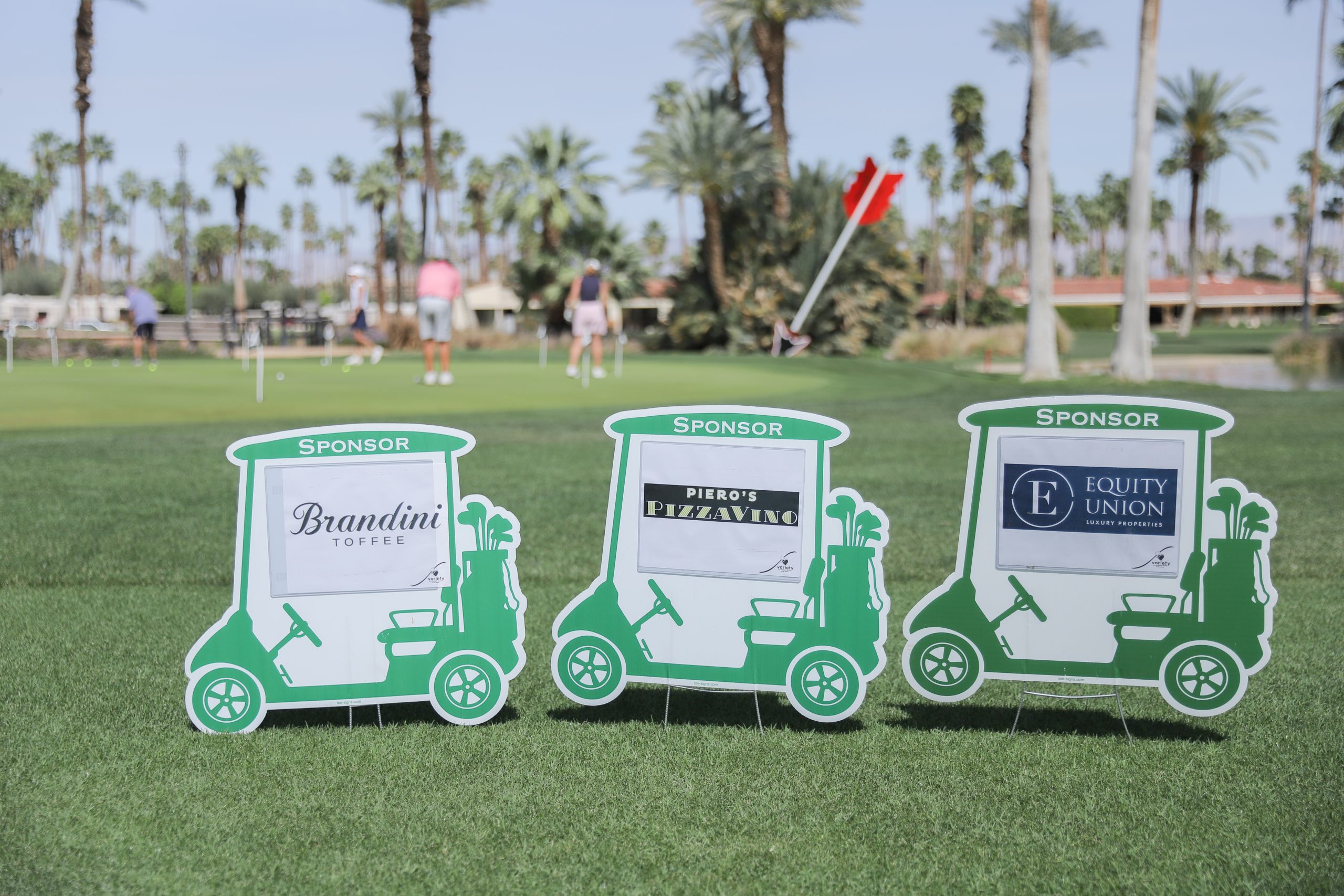 community-partners.jpg Sponsor signs displayed on the golf course during Variety of the Desert's annual golf tournament.