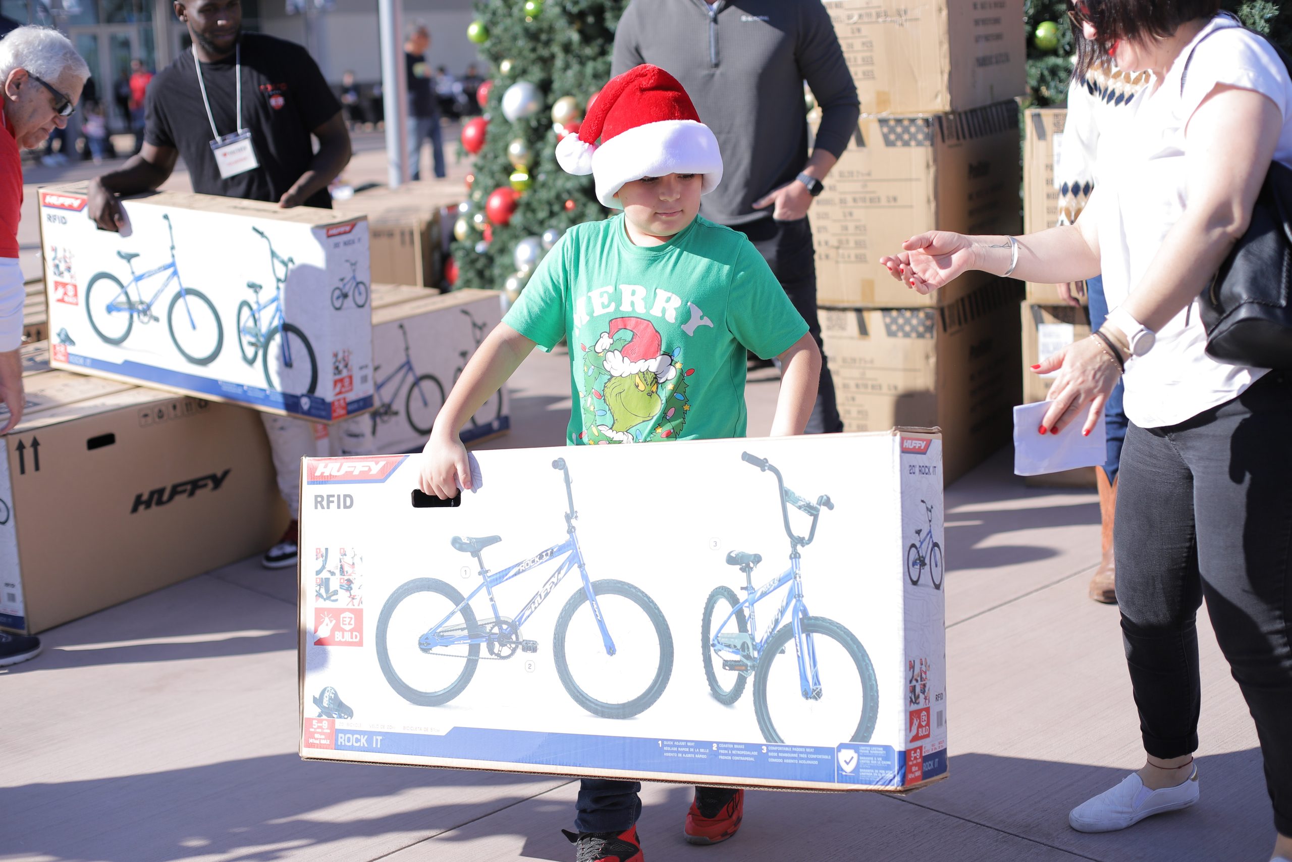 bike-giveaway-student.png Child receiving a bicycle through Variety of the Desert's annual Bike Giveaway.