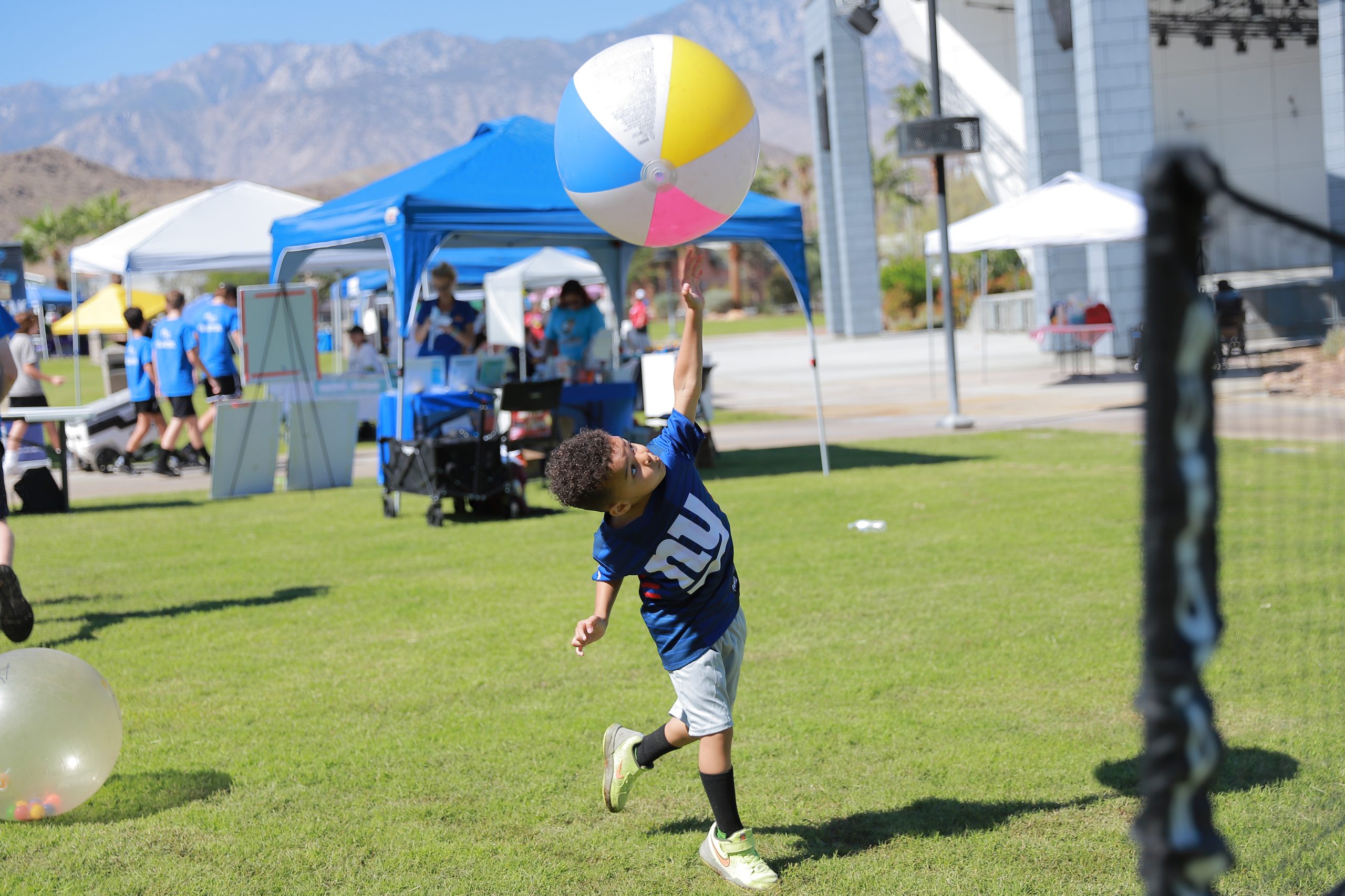 fall-carnival-activities.png Child enjoying a game during a Variety of the Desert Family Fun event.