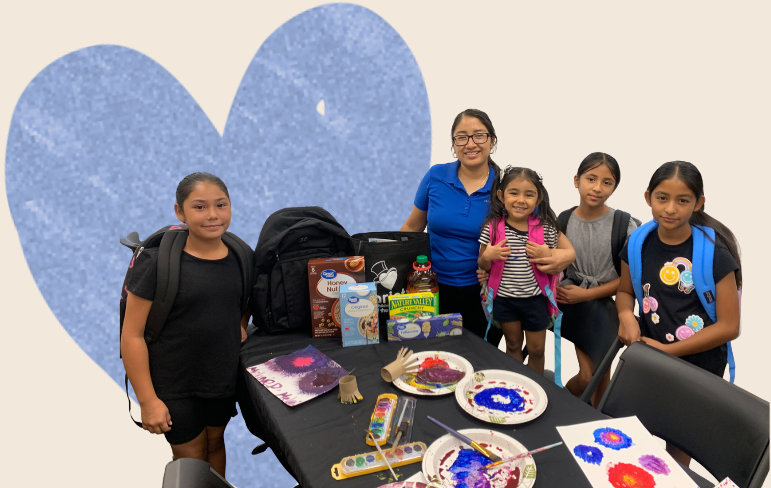 mari-family-food-assistance.png Family participating in a Variety of the Desert art event while receiving food and backpacks.