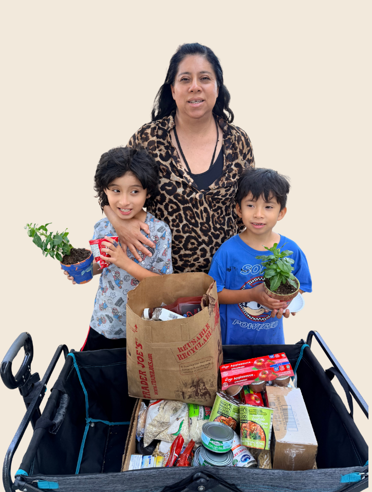 family-food-assistance.png Family receiving food assistance through Variety of the Desert's Outreach Program.