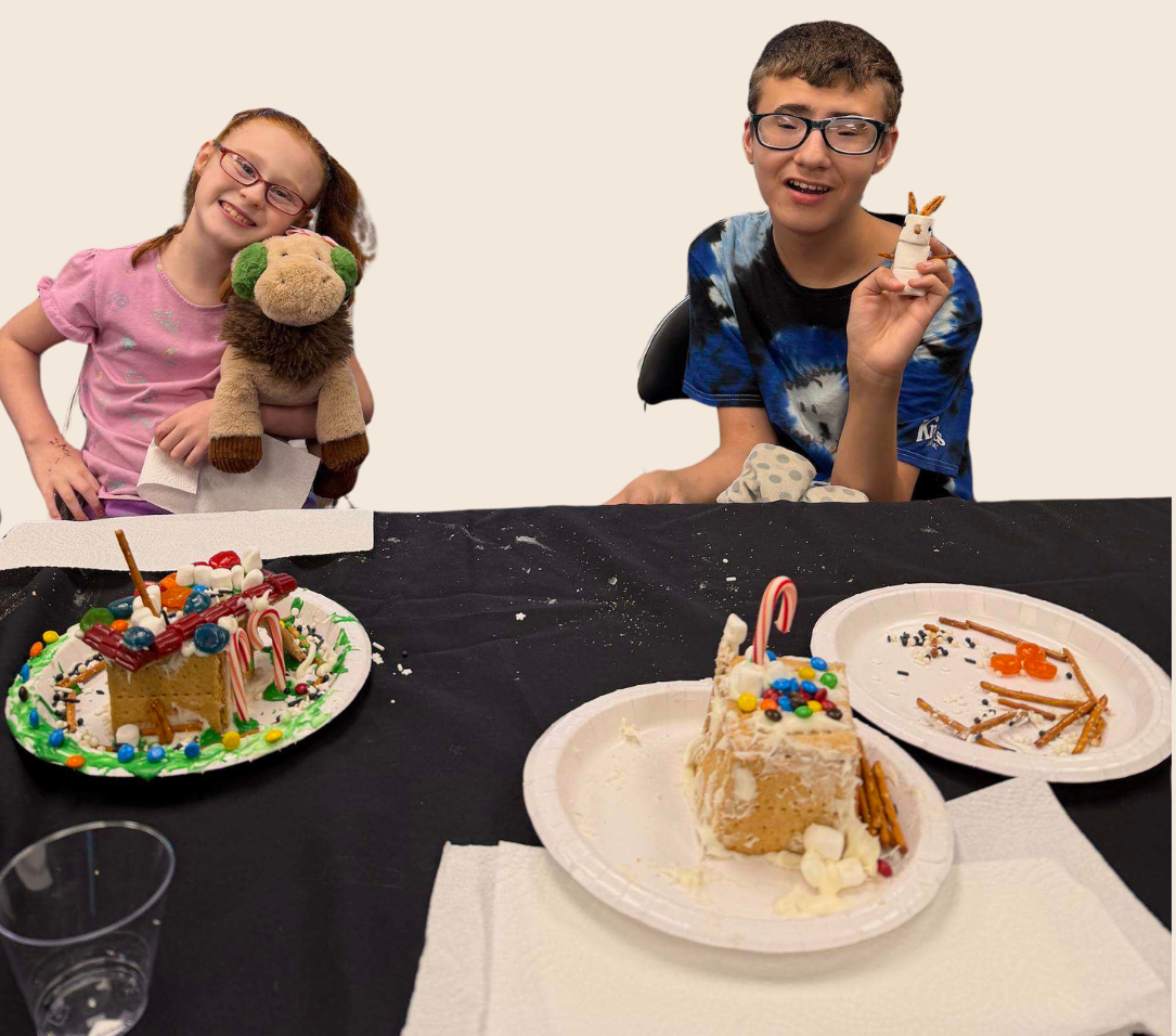inclusive-art-activity.png Children proudly displaying holiday crafts created during a Variety of the Desert art program.